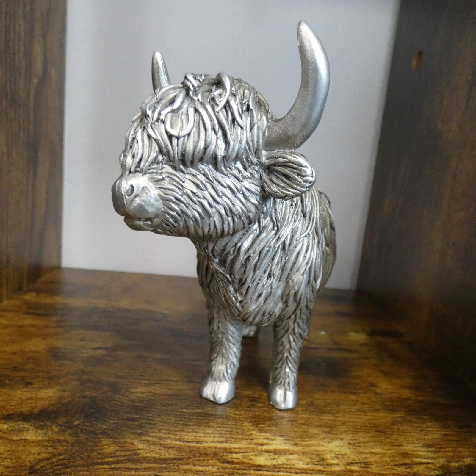 silver highland cow statue