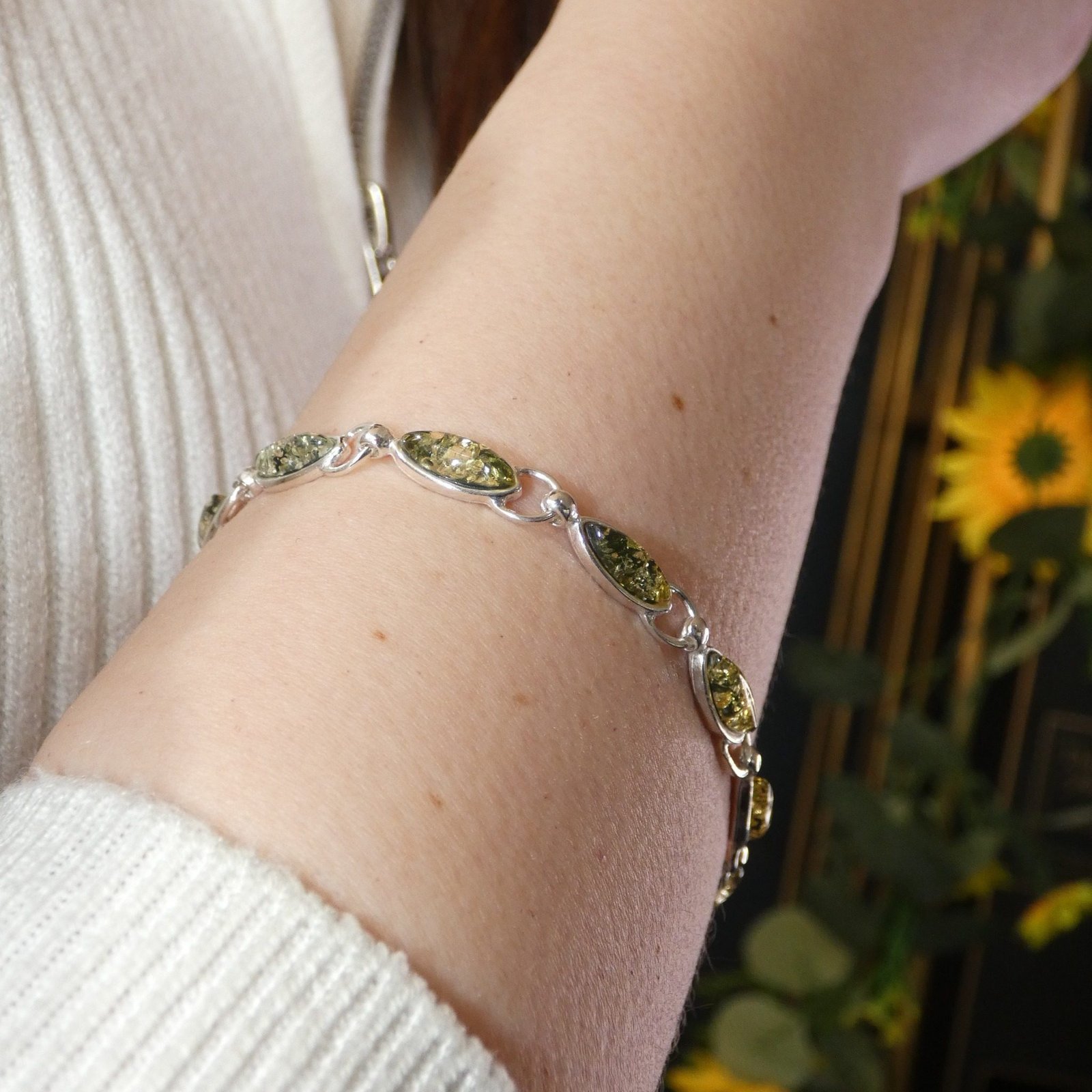 amber silver bracelet handmade jewellery durham uk moon jewellery Polish designer green amber bracelet worn on wrist