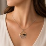 Deep green Baltic amber stone in mirrored sterling silver wave frame