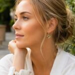 Contemporary green amber crescent drop earrings worn handcrafted Polish artist