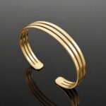 Three fine lines of 14ct gold plated sterling silver 925 triple bangle bracelet close up