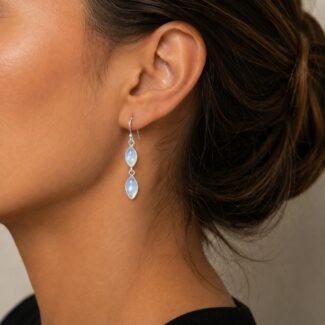 Handmade moonstone drop earrings worn moving blue shimmer 42mm sterling silver