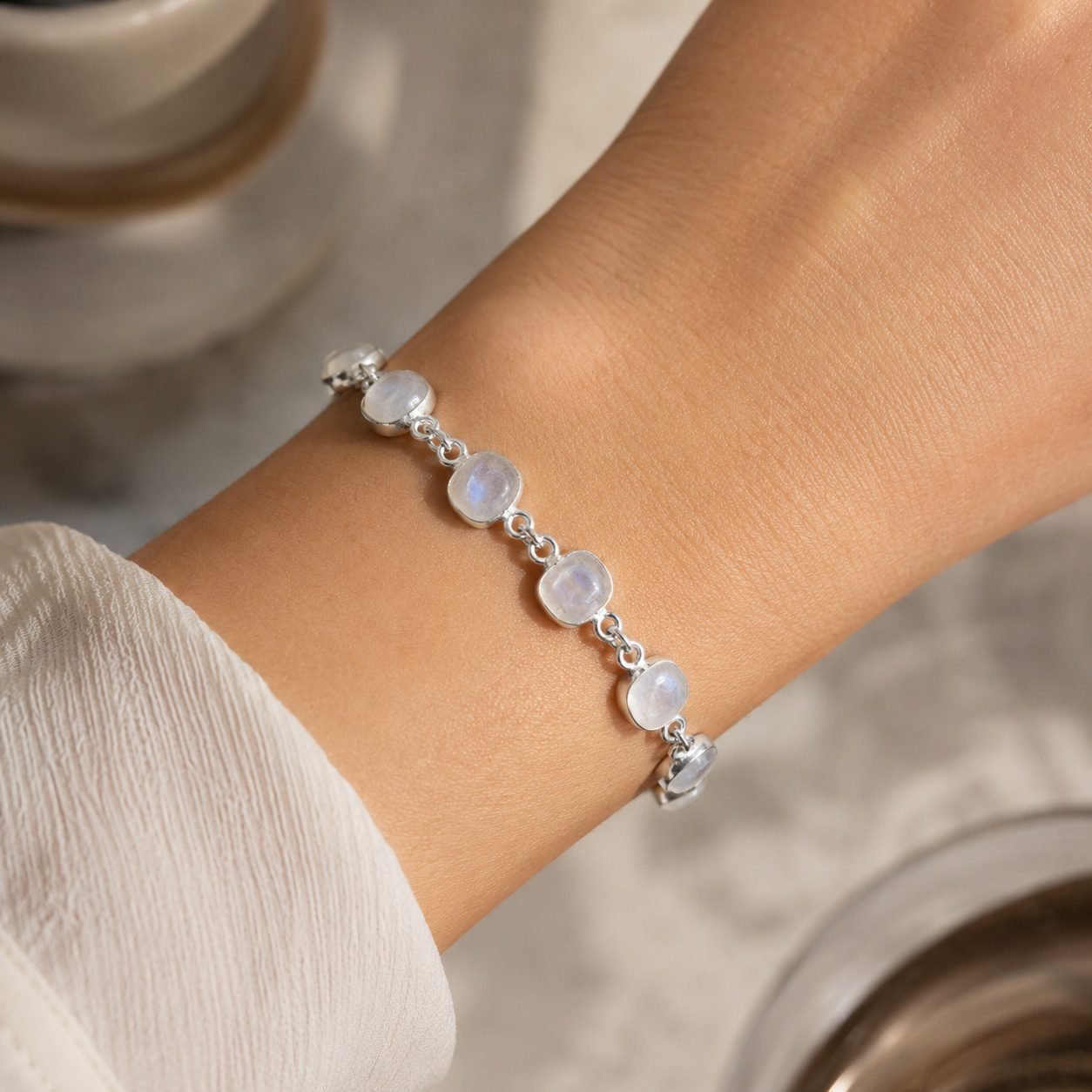 moonstone_bracelet_handmade_jewellery_uk_moon_jewellery Handmade square moonstone bracelet worn on wrist stacked with moonstone marquise bracelet