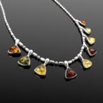 Amber collar necklace with citrine green and cognac triangular charms sterling silver
