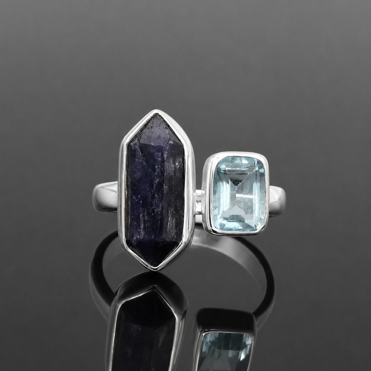 Sri Lankan sapphire and Brazilian blue topaz faceted stones in sterling silver open band ring