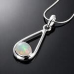Natural Ethiopian opal cabochon play of colour green pink red blue in mirrored silver frame