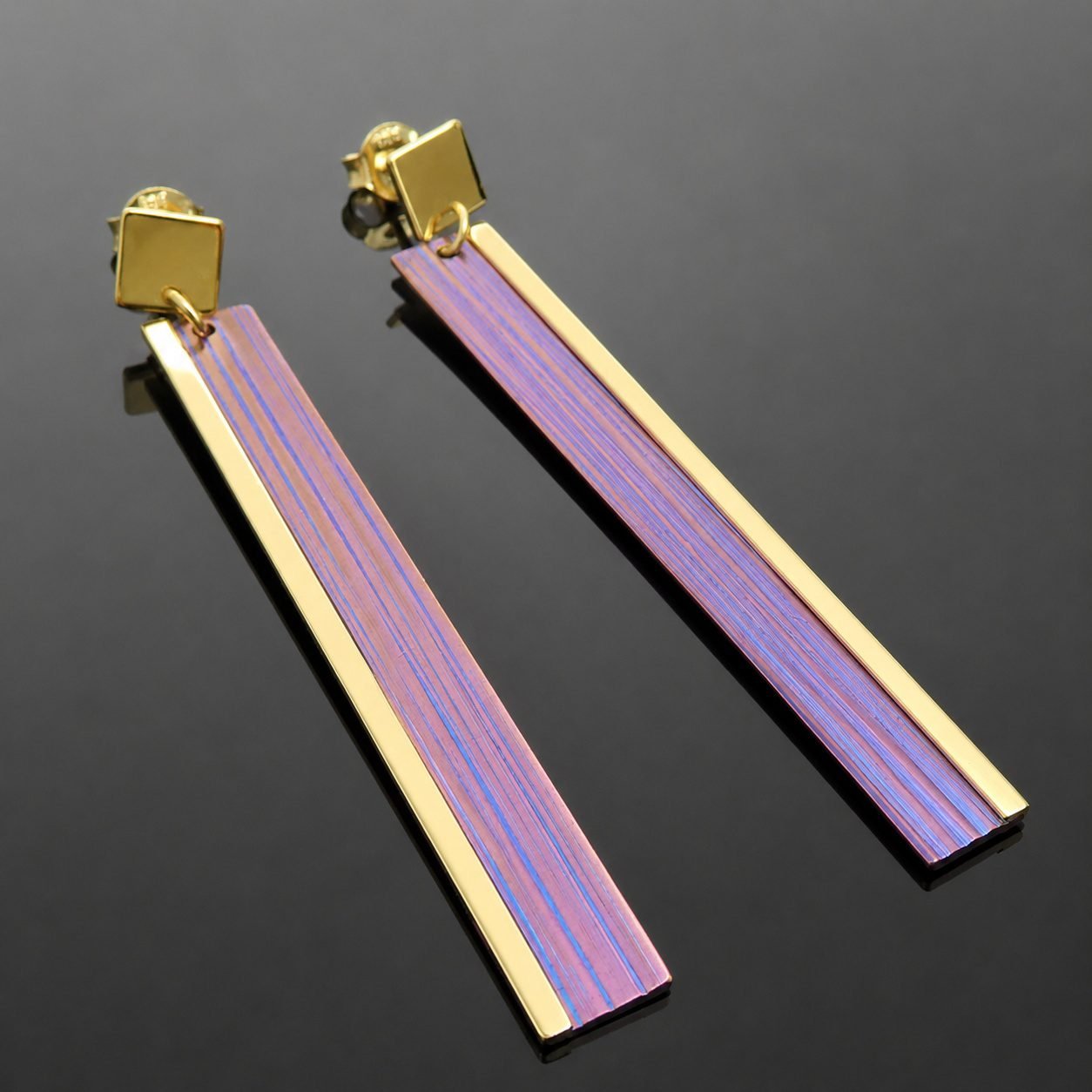 titanium statement earrings handmade jewellery uk moon jewellery Anodised titanium pink blue purple hues with mirrored gold plated silver oblong drop earring