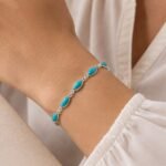 Handmade Tibetan turquoise bracelet worn on wrist mirrored silver frame classic design