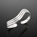 Three parallel wave lines mirrored sterling silver 925 cuff bracelet close up