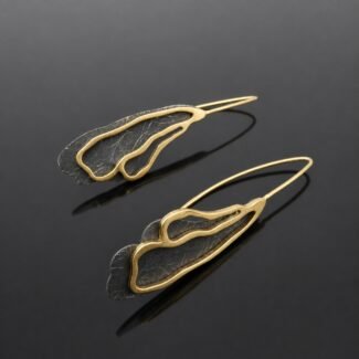 Ruthenised sterling silver deep black and brushed gold plated abstract curl earring close up