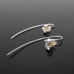 Satin finish sterling silver pansy bloom with gold stem detail earring 16mm front close up