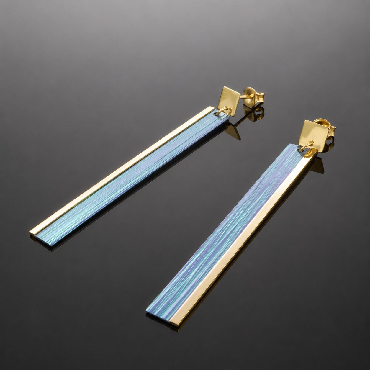 Anodised green titanium blue gold hues with mirrored gold plated silver oblong drop earring