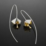 Sharp angled origami flower sterling silver gold plated front oxidised back close up