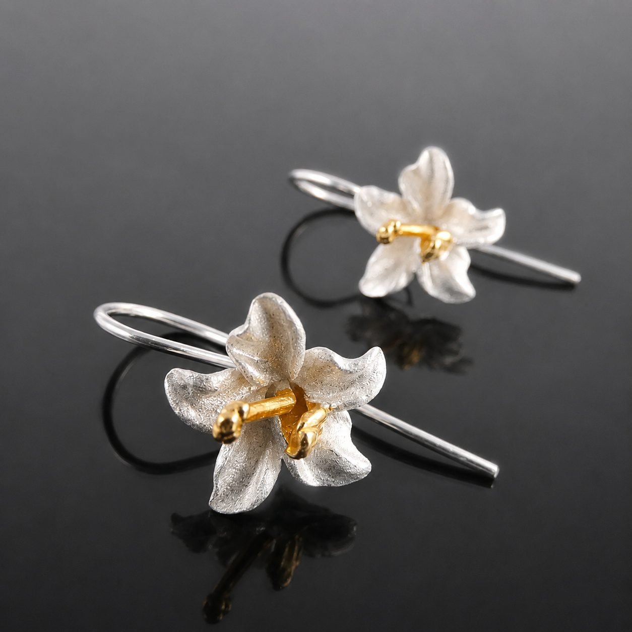 silver_gold_flower_earrings_handmade_jewellery_uk_moon_jewellery sterling silver orchid earrings moon jewellery uk