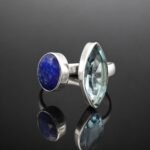 Deep blue oval faceted sapphire and sky blue marquise topaz in mirrored sterling silver 925 ring