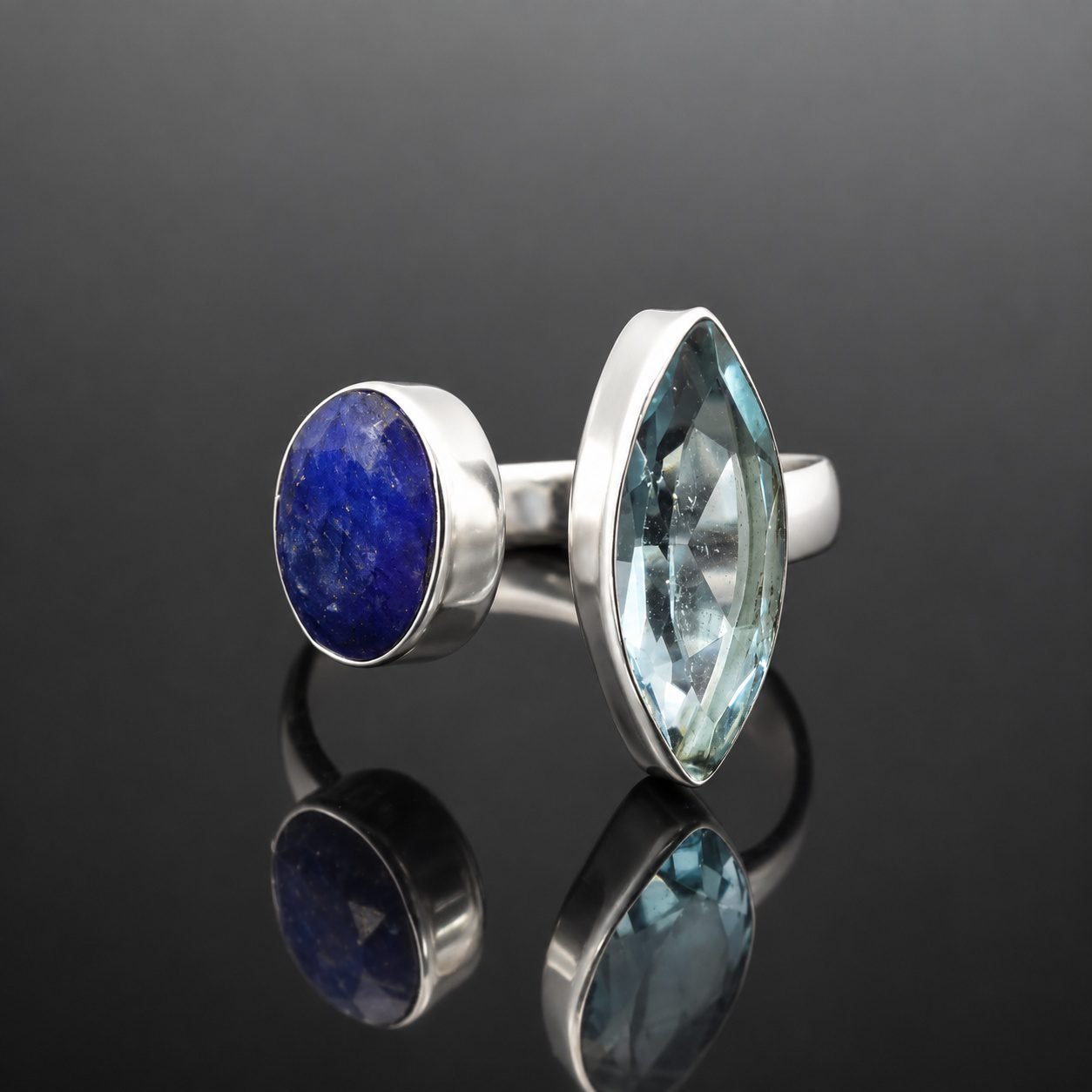 topaz and sapphire handmade ring silver jewellery uk moon jewellery Deep blue oval faceted sapphire and sky blue marquise topaz in mirrored sterling silver 925 ring