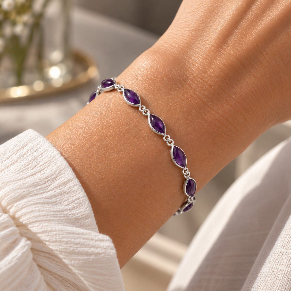 Handmade amethyst bracelet worn on wrist deep purple marquise mirrored silver links