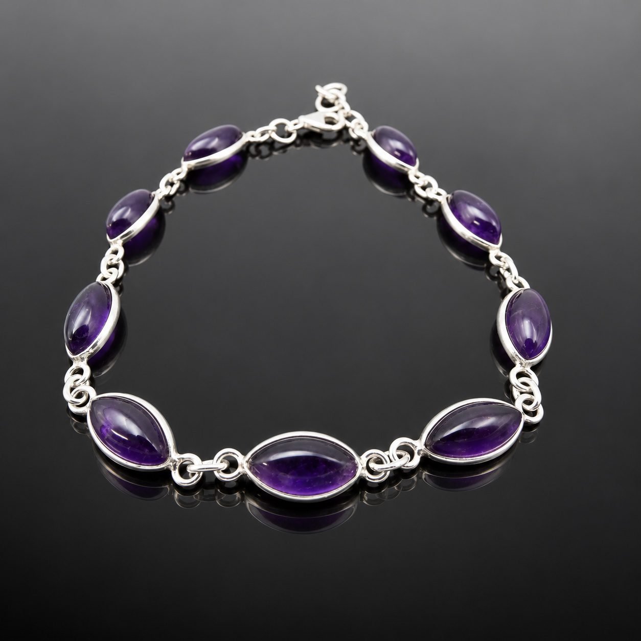Deep purple marquise amethyst set in mirrored sterling silver 925 link bracelet close up