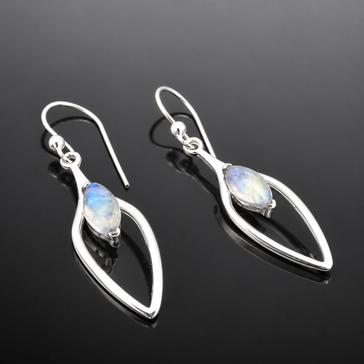 moonstone drop earrings handmade jewellery durham uk moon jewellery Marquise moonstone glowing in contemporary cut out frame mirrored sterling silver 925 earring close up