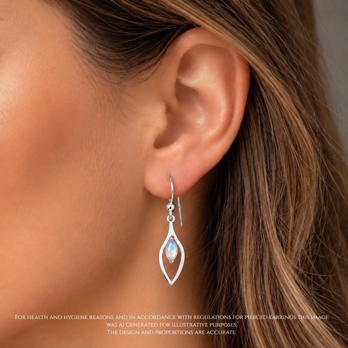 moonstone drop earrings handmade jewellery uk moon jewellery Handmade marquise moonstone earrings worn mirrored silver cut out frame contemporary